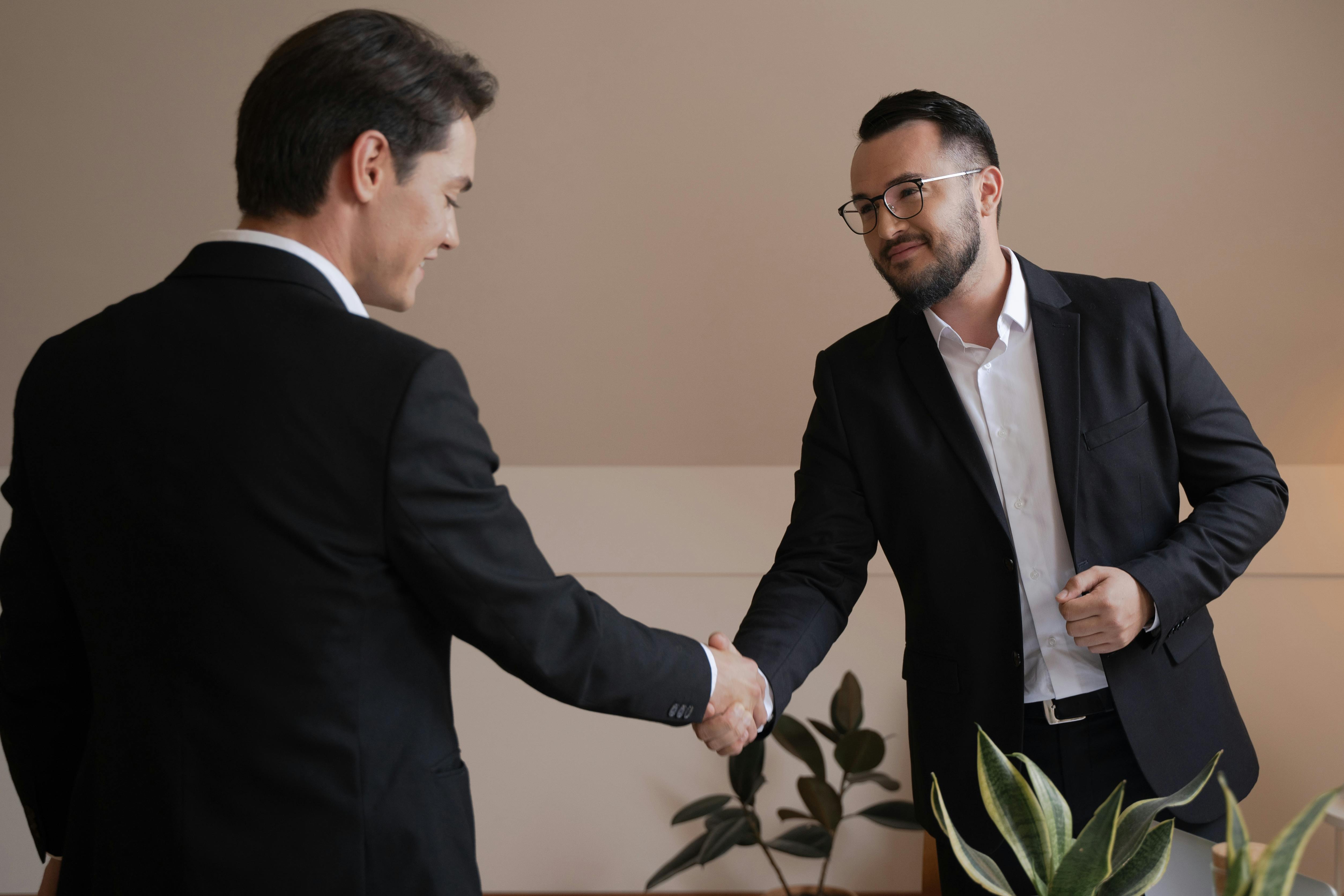 Business partnership handshake